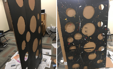 Paint splatters on box with holes