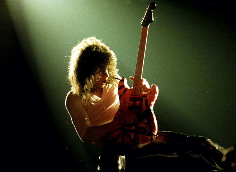 Eddie Van Halen, shredding his Frankenstrat guitar live in concert. Photo taken by K. Todd Storch (under CC BY-NC-ND 2.0, no changes have been made.)