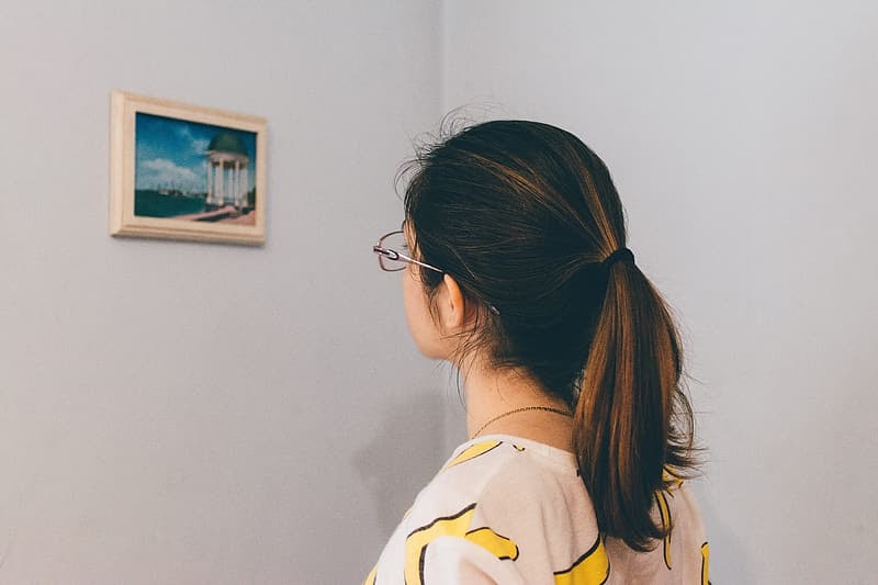 Woman staring at a wall