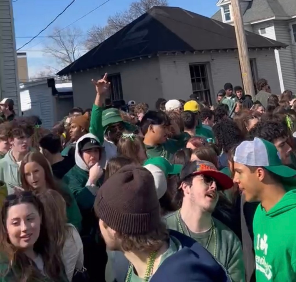 Image of SUNY student partiers on St. Patrick's Day.